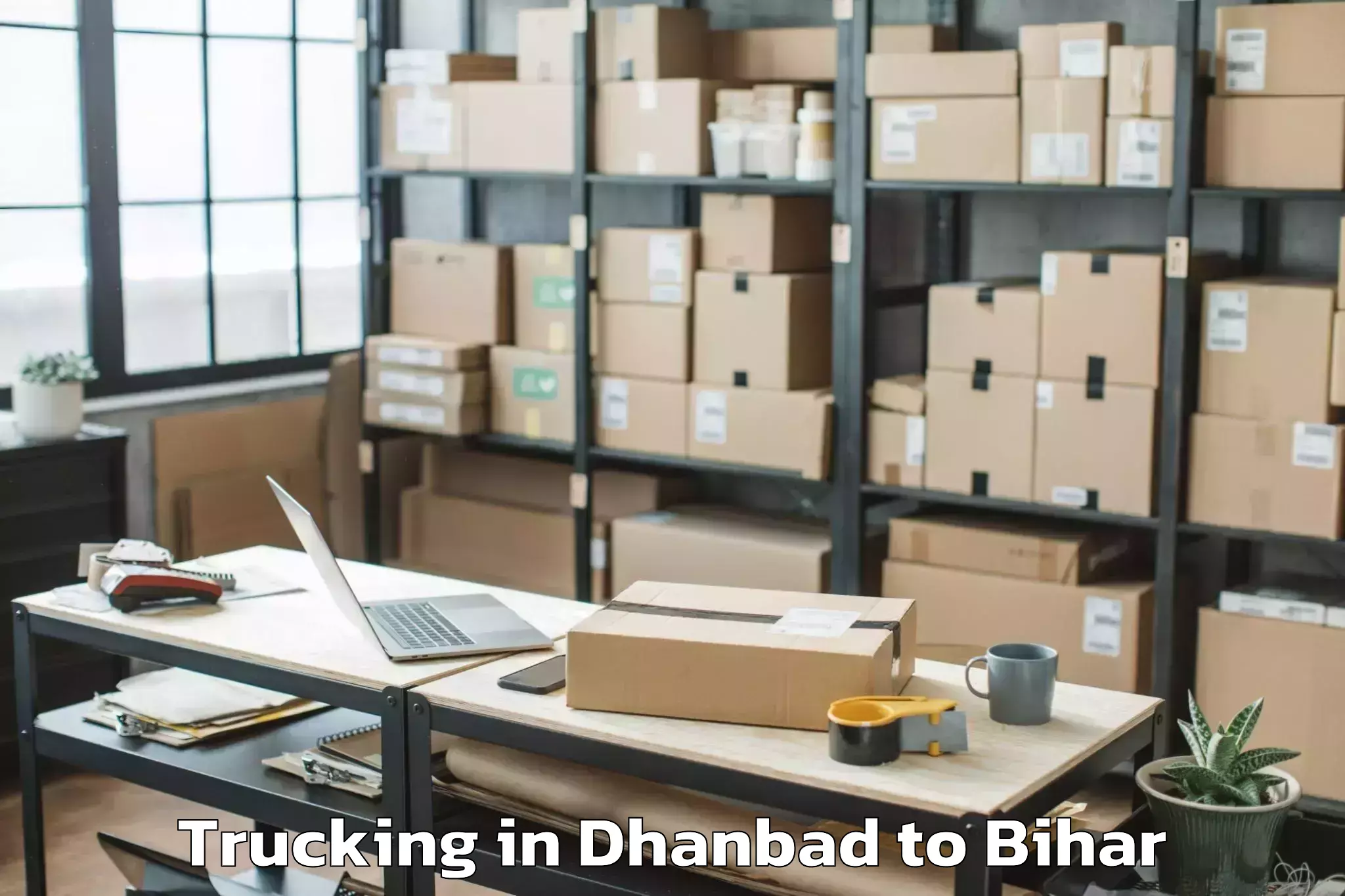 Book Dhanbad to Thakrahan Trucking